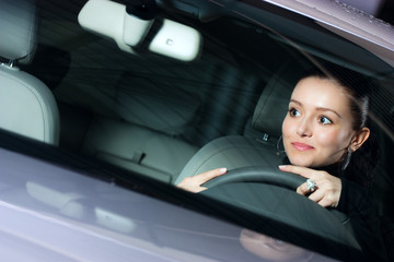 young pretty woman driving car
