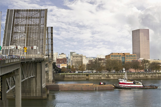 Tug Boat Under Bridge on River © David Gn
