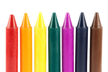 Colored wax crayons isolated on white background