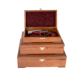 Casket with a toy pistol