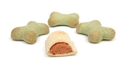 Funny shaped dog cookies over white background