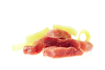 chunks of fresh meat and pepper isolated on white