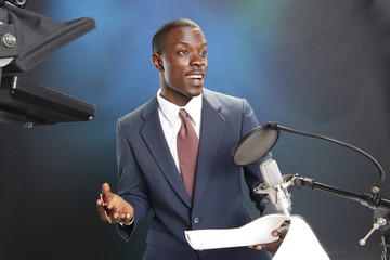 TV/Radio news anchor with prompter and microphone