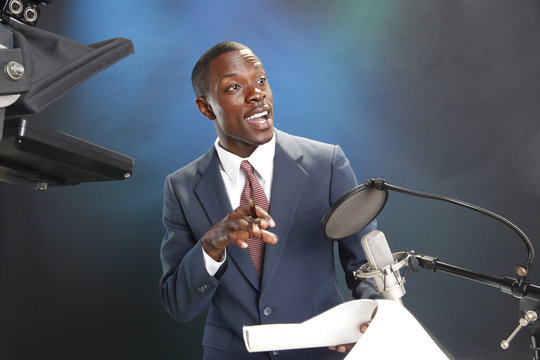 TV/Radio news anchor with prompter and microphone
