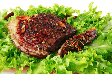 served steak with raw salad
