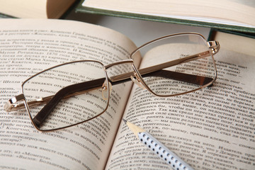 Spectacles on book