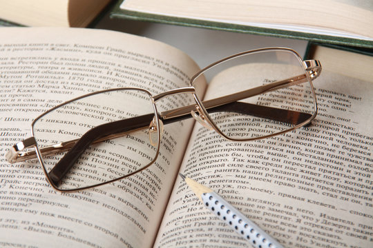 Spectacles on book