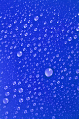 Water drops background with big and small drops