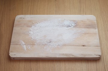 A lightly floured chopping board