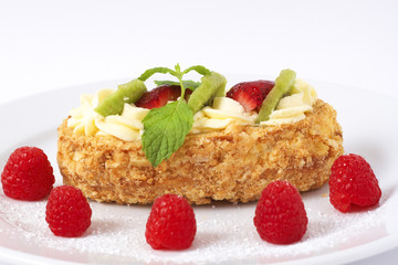 Fruit boat cake with raspberries