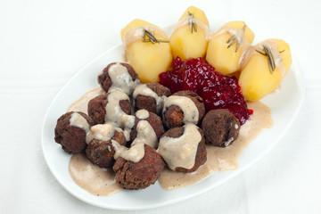 Swedish Kottbullar meatball with brunsas sauce, boiled potatoes