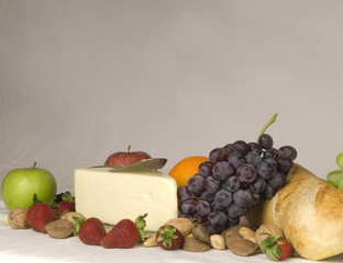 Buffet of fruit nuts bread and cheese 600