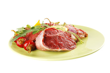 Fototapeta premium raw beef medallion on green