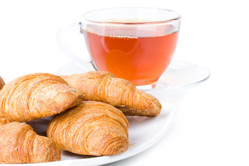 Fresh croissant and cup of tea
