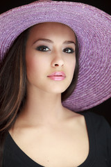 Beautiful Young Woman with Purple Hat