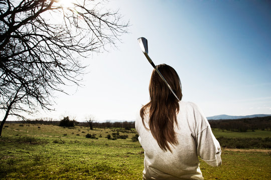 woman with golf club