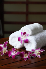 pink orchid on white towels