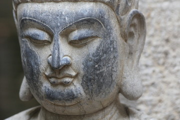 Fototapeta na wymiar Buddha aus Stein - Stone Buddha