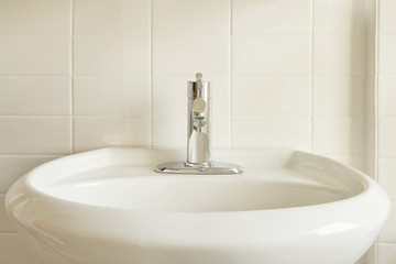 White Porcelain Sink and White Tile