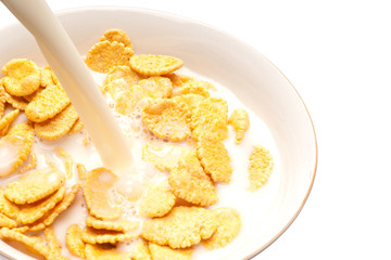 Corn-flakes on white plate.