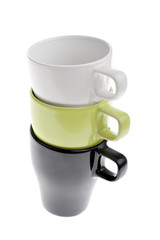 Three stacked white green and black coffee cups