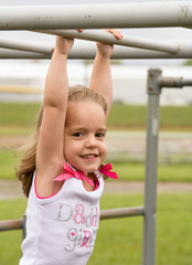Fototapeta premium Little Girl Playing Outside With Big Smile