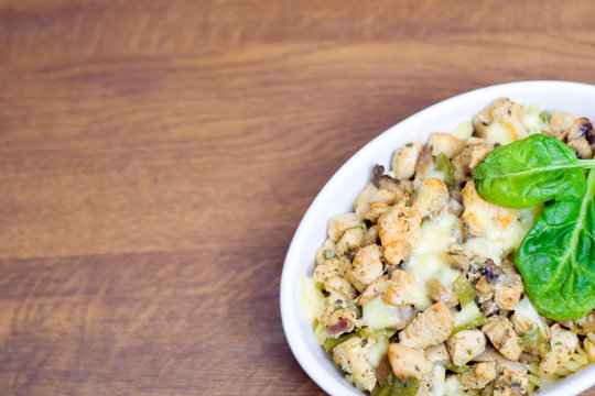 Chicken casserole with spinach on table