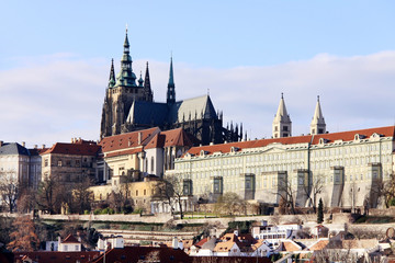 The snowy Prague gothic Castle above the River Vltava