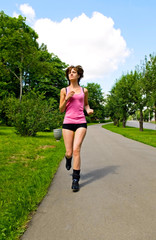 young woman running in park