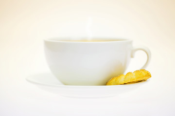 white cup and pastry isolated on white