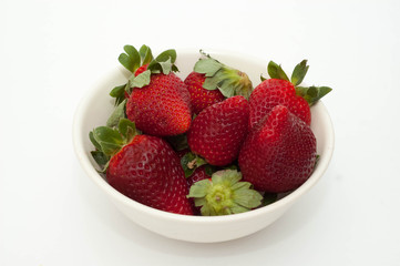 Strawberries isolated over white background.