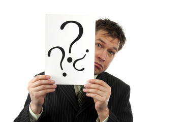 Businessman is holding question marks over white background