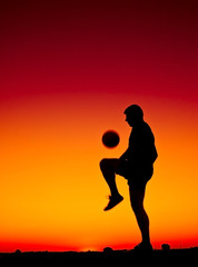 Fototapeta na wymiar football at sunset