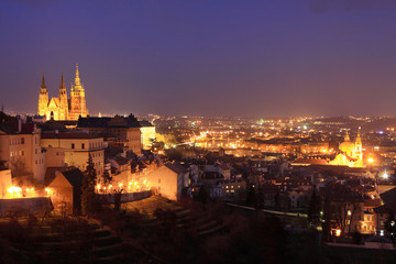 Fototapeta na wymiar The night View to bright Prague with gothic Castle