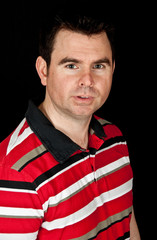 male in red t-shirt on black screen