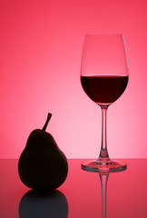 Red wine in a glass with a pear