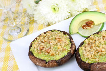 Avocado and walnut stuffed portabella mushrooms.