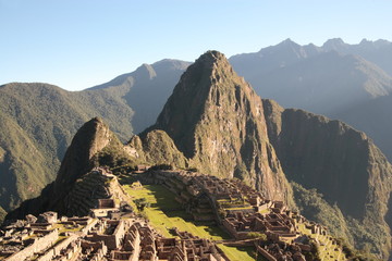 Ancient ruins of Machu Picchu in Peru on a sunny day © Achim Baqué