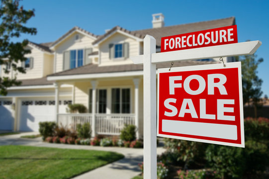 Foreclosure Real Estate Sign and House