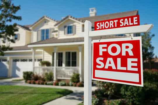 Short Sale Real Estate Sign and House