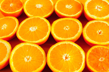 Orange halves creating bright background