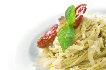 Italian Pasta with Pesto sauce,olives,basil and dried tomato
