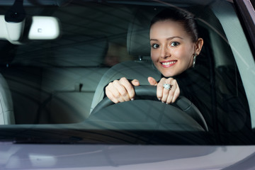 young pretty woman driving car