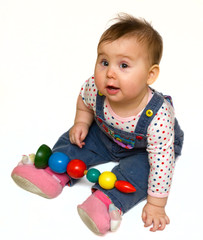 Happy baby girl played with color toy