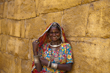 indian woman with traditional Rajasthani clothes and jewelry.