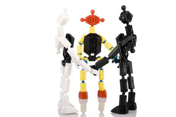 team of toy bricks people in a circle with a leader