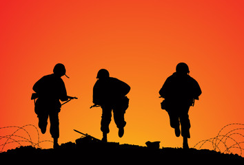 Fototapeta na wymiar Silhouette of three soldiers on the battlefield