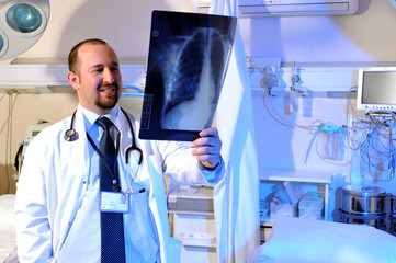Medical doctor looking at a chest roentgen