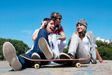 Teenagers Sitting by a street