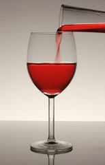 red wine in glass and bottle